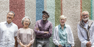 group of elderly smiling in a retirement house